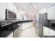 Contemporary kitchen with stainless steel appliances, white cabinetry, and an open layout at 8315 Raoul Ave, North Port, FL 34291