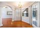 Elegant living room featuring hardwood floors, arched entryways, and a view of the outdoor pool at 8315 Raoul Ave, North Port, FL 34291