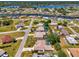This aerial view showcases a home's canal-front neighborhood at 452 Greenwich Nw Ave, Port Charlotte, FL 33952