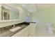 Bathroom featuring granite countertops and a garden tub at 452 Greenwich Nw Ave, Port Charlotte, FL 33952