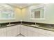 Bathroom featuring double sinks and granite countertops at 452 Greenwich Nw Ave, Port Charlotte, FL 33952