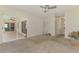 Spacious carpeted bedroom with sliding glass doors and windows at 452 Greenwich Nw Ave, Port Charlotte, FL 33952