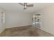 Bright bedroom with carpet floors and sliding glass doors to the screened lanai at 452 Greenwich Nw Ave, Port Charlotte, FL 33952