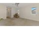 Spacious carpeted bedroom with three windows and a ceiling fan at 452 Greenwich Nw Ave, Port Charlotte, FL 33952