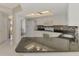 Kitchen featuring white appliances, white cabinetry, tile backsplash and black countertops at 452 Greenwich Nw Ave, Port Charlotte, FL 33952