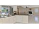 Kitchen featuring modern appliances and a view into the living room at 452 Greenwich Nw Ave, Port Charlotte, FL 33952