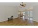 Spacious living room offering seamless access to the dining area and featuring elegant double door entryway at 452 Greenwich Nw Ave, Port Charlotte, FL 33952