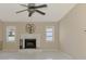 Comfortable living room featuring a traditional fireplace, creating a cozy focal point for gatherings and relaxation at 452 Greenwich Nw Ave, Port Charlotte, FL 33952