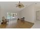 Inviting living room with wood floors and access to the pool, showcasing a blend of comfort and entertainment at 452 Greenwich Nw Ave, Port Charlotte, FL 33952