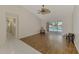 Open-concept living area with views of the pool through sliding glass doors, seamlessly connecting indoor and outdoor spaces at 452 Greenwich Nw Ave, Port Charlotte, FL 33952