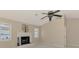 Bright living room with a cozy fireplace and high ceilings, creating a comfortable and inviting atmosphere for relaxation at 452 Greenwich Nw Ave, Port Charlotte, FL 33952