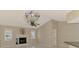 Living room with decorative fireplace, and a stained glass chandelier at 452 Greenwich Nw Ave, Port Charlotte, FL 33952