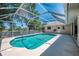 A screened-in pool area with a backyard at 452 Greenwich Nw Ave, Port Charlotte, FL 33952