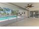 A clear, sparkling pool provides a refreshing escape, surrounded by a screened enclosure at 452 Greenwich Nw Ave, Port Charlotte, FL 33952