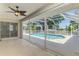 Relaxing screened-in patio with access to a sparkling in-ground pool at 452 Greenwich Nw Ave, Port Charlotte, FL 33952