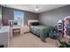 This cute bedroom features a large window, vanity and unique decor at 11663 Anhinga Ave, Venice, FL 34292