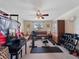 This bonus room features a home gym and leather couches and chairs at 11663 Anhinga Ave, Venice, FL 34292