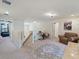 A bonus room featuring carpet floors, comfortable seating, and an open layout at 11663 Anhinga Ave, Venice, FL 34292