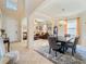 Inviting foyer that leads into a living room and dining room, featuring a console table at 11663 Anhinga Ave, Venice, FL 34292