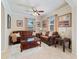 Cozy living room with two couches, neutral colors, and natural light at 11663 Anhinga Ave, Venice, FL 34292