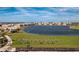 A lovely aerial view showing the community's water feature and putting range at 14204 Heritage Landing Blvd # 712, Punta Gorda, FL 33955