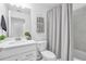 Bright bathroom featuring a white vanity, decorative towels, and shower with grey tiling at 14204 Heritage Landing Blvd # 712, Punta Gorda, FL 33955