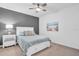 Cozy bedroom with neutral decor, ceiling fan, and comfortable furnishings at 14204 Heritage Landing Blvd # 712, Punta Gorda, FL 33955