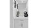 Chic coffee bar with white cabinetry and countertops for at-home caffeine fixes at 14204 Heritage Landing Blvd # 712, Punta Gorda, FL 33955
