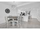 Open-concept kitchen with white cabinetry, stainless steel appliances, and adjacent dining area at 14204 Heritage Landing Blvd # 712, Punta Gorda, FL 33955