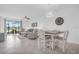 Bright living room featuring an open-concept layout with tile flooring, and view of screened patio at 14204 Heritage Landing Blvd # 712, Punta Gorda, FL 33955