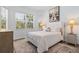 Comfortable bedroom with plush bedding, ample natural light, and a calming color scheme at 14413 Heritage Landing Blvd, Punta Gorda, FL 33955
