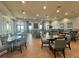 Spacious dining area with wood-look floors, neutral tones, and large windows offering plenty of natural light at 14413 Heritage Landing Blvd, Punta Gorda, FL 33955