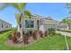 Charming single-story home with manicured landscaping, and a two-car garage at 14413 Heritage Landing Blvd, Punta Gorda, FL 33955