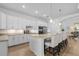 Modern kitchen with a large island, stainless steel appliances, and white cabinetry at 14413 Heritage Landing Blvd, Punta Gorda, FL 33955