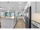 Bright kitchen features a large center island, granite countertops, and stainless steel appliances at 14413 Heritage Landing Blvd, Punta Gorda, FL 33955