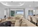 Bright and airy living room featuring a comfortable sectional sofa, and outdoor views at 14413 Heritage Landing Blvd, Punta Gorda, FL 33955