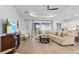 Spacious living room with a comfortable sectional sofa, stylish decor, and a view of the backyard at 14413 Heritage Landing Blvd, Punta Gorda, FL 33955