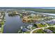 Aerial view captures homes with waterfront access, nestled within a community surrounded by winding canals at 15490 Seafoam Cir, Port Charlotte, FL 33981