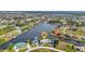 Aerial view of a waterfront property featuring a private dock and scenic views of the surrounding waterways at 15490 Seafoam Cir, Port Charlotte, FL 33981