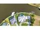 Stunning aerial view of a waterfront property with a boat dock, and swimming pool at 15490 Seafoam Cir, Port Charlotte, FL 33981