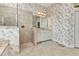 Bathroom featuring a glass shower, vanity, and large mirror at 15490 Seafoam Cir, Port Charlotte, FL 33981