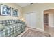 View of the bedroom that features a daybed with a closet and a doorway leading to the bathroom at 15490 Seafoam Cir, Port Charlotte, FL 33981