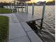 A pristine boat dock is ready for waterfront fun and relaxation at 15490 Seafoam Cir, Port Charlotte, FL 33981