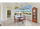 Bright dining area offering clear view of the lanai and pool at 15490 Seafoam Cir, Port Charlotte, FL 33981
