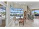 Dining area with large glass window providing scenic views of the lanai and pool at 15490 Seafoam Cir, Port Charlotte, FL 33981