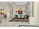 Elegant dining room featuring a decorative rug, chandelier, and stylish furniture at 15490 Seafoam Cir, Port Charlotte, FL 33981