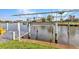 Waterfront views from a dock equipped with a boat lift providing direct access to the waterway at 15490 Seafoam Cir, Port Charlotte, FL 33981