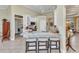Bright kitchen featuring granite countertops, stainless steel appliances, and convenient breakfast bar with stool seating at 15490 Seafoam Cir, Port Charlotte, FL 33981