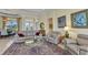 Comfortable living space featuring tile floors, neutral furnishings, and decorative accents at 15490 Seafoam Cir, Port Charlotte, FL 33981