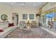 Spacious living area with tile floors, comfortable seating, and views of the outdoor area at 15490 Seafoam Cir, Port Charlotte, FL 33981